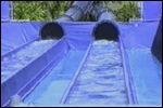 Two different approaches to sliding down a Water Park slide