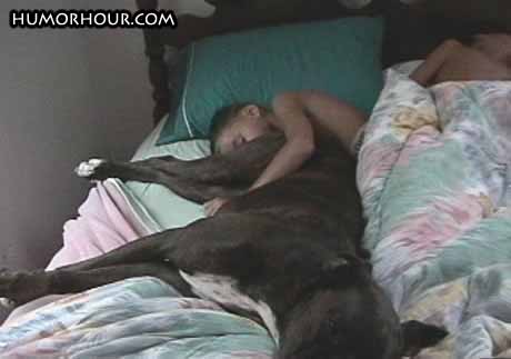 Sleeping with his dog
